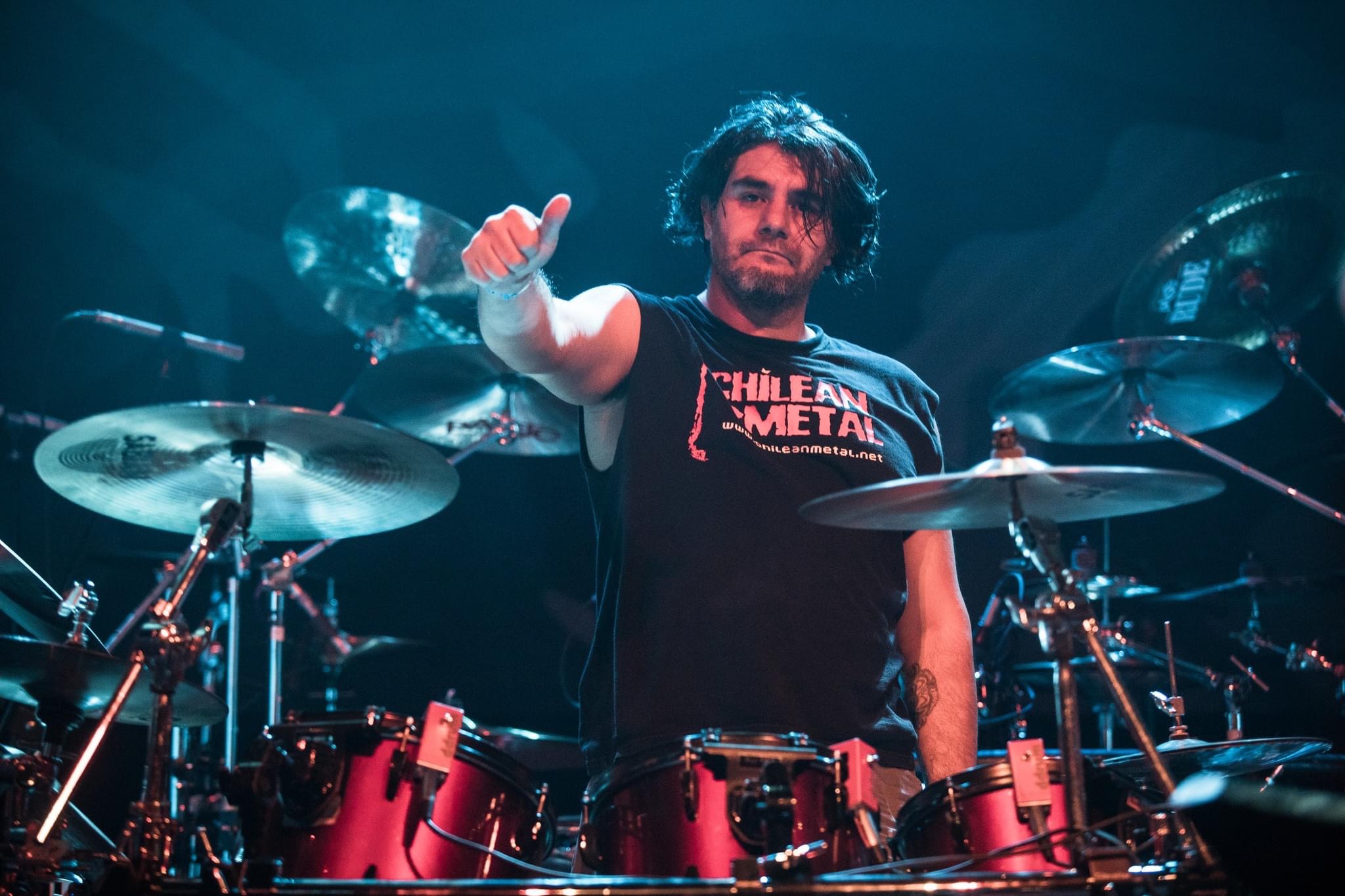 Ignacio Orellana at the drums giving a thumbs up