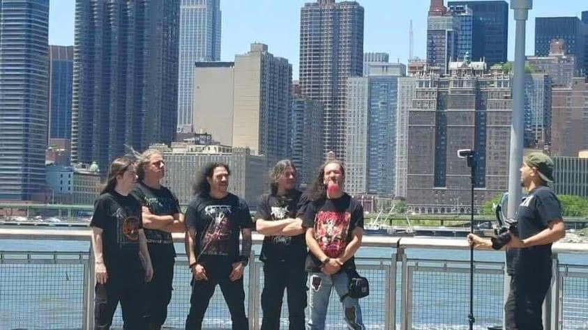 Ignacio Orellana filming a band beside the New York waterfront